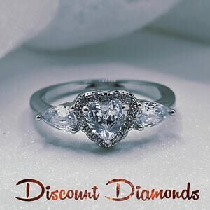 White Heart Shaped Diamond Ring Flanked by 2 Diamonds &  Baguette Diamonds & 925